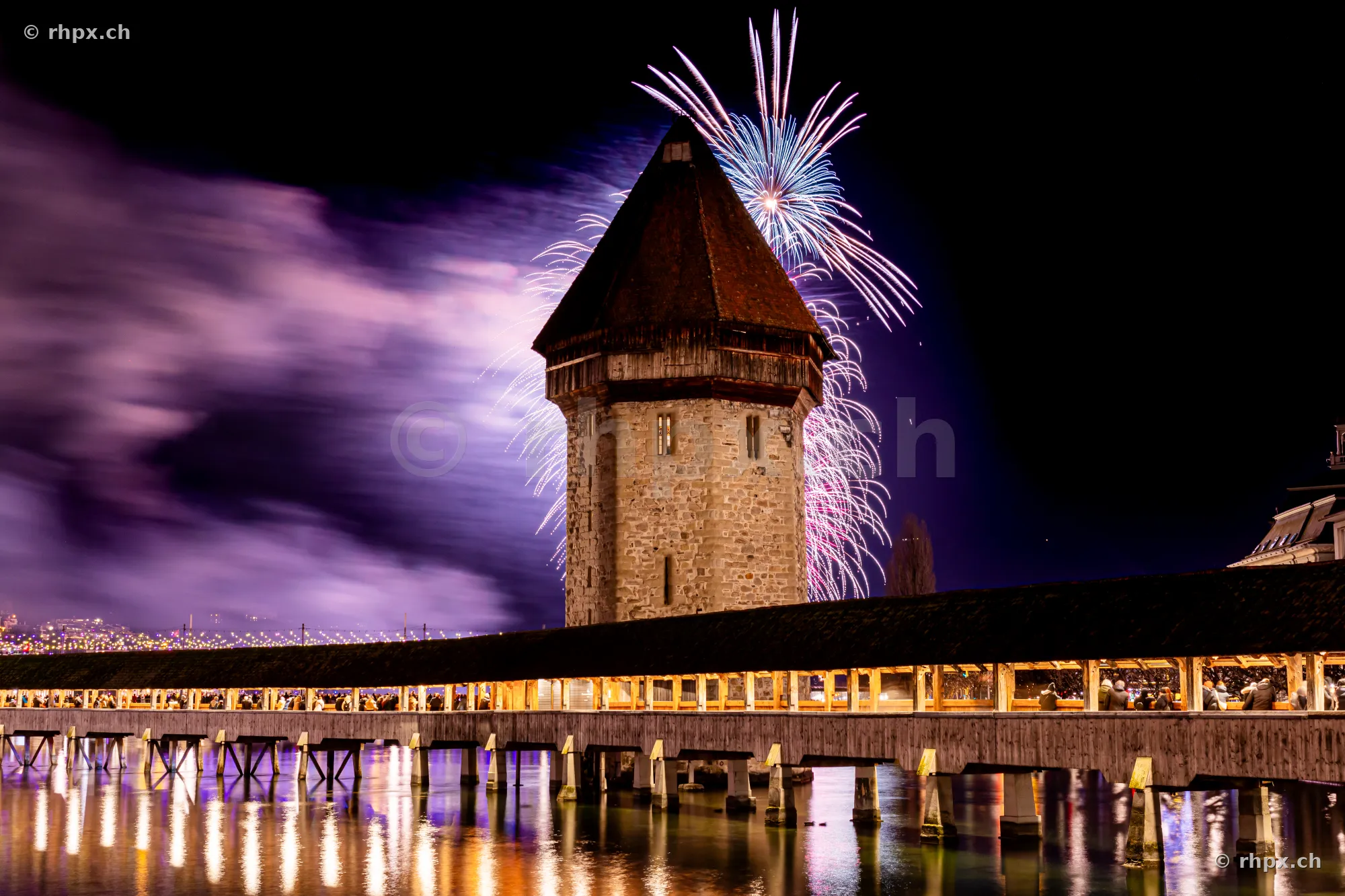 Fireworks above the Water Tower of the Chapel Bridge in Lucerne at night