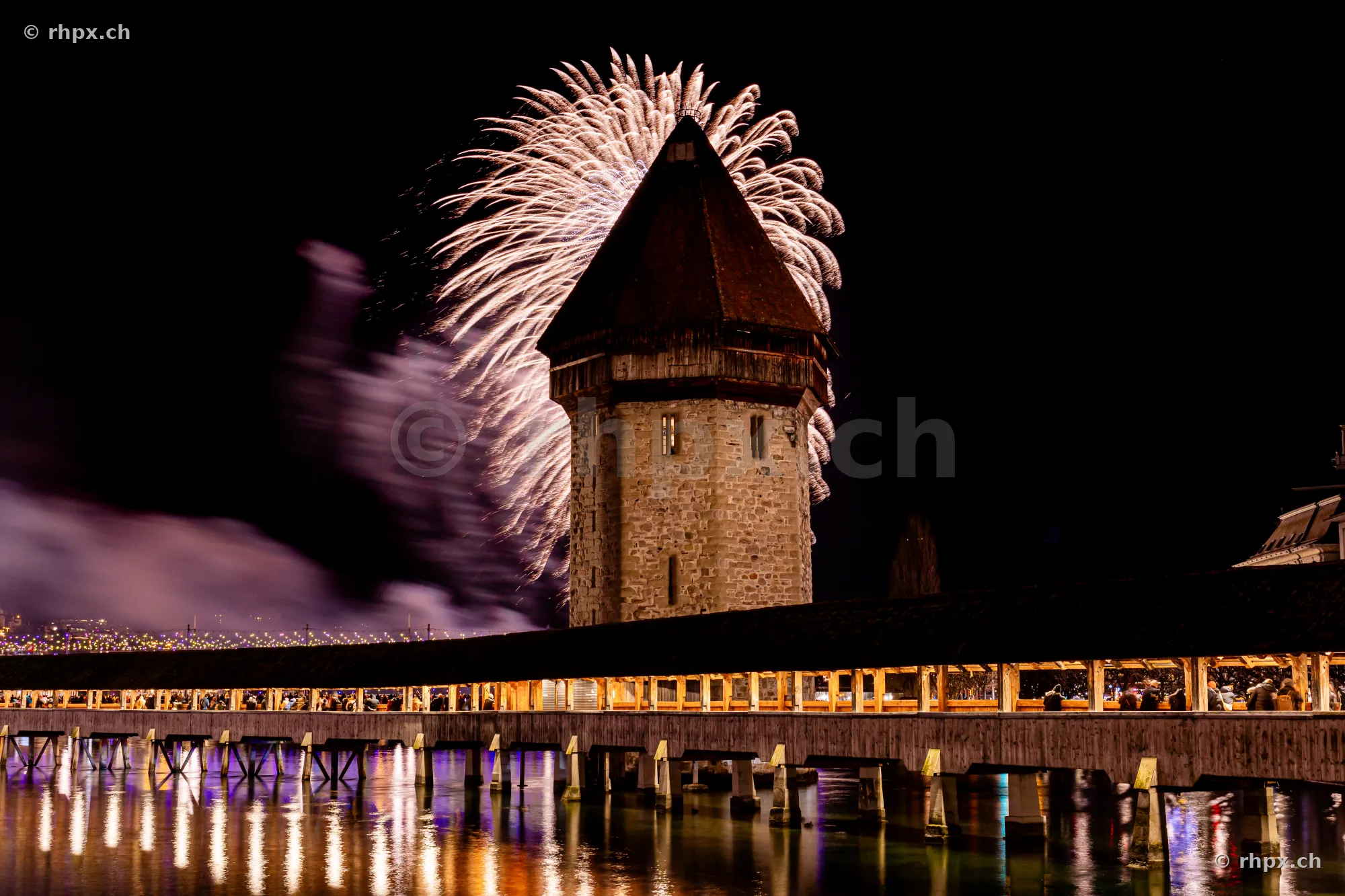 Nightly fireworks over the Wasserturm of the Chapel Bridge in Lucerne