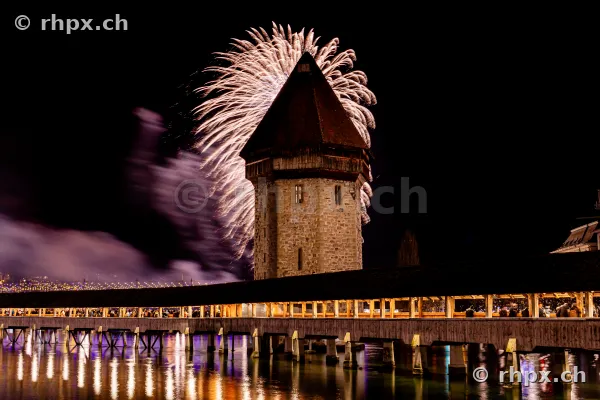 Nightly fireworks over the Wasserturm of the Chapel Bridge in Lucerne