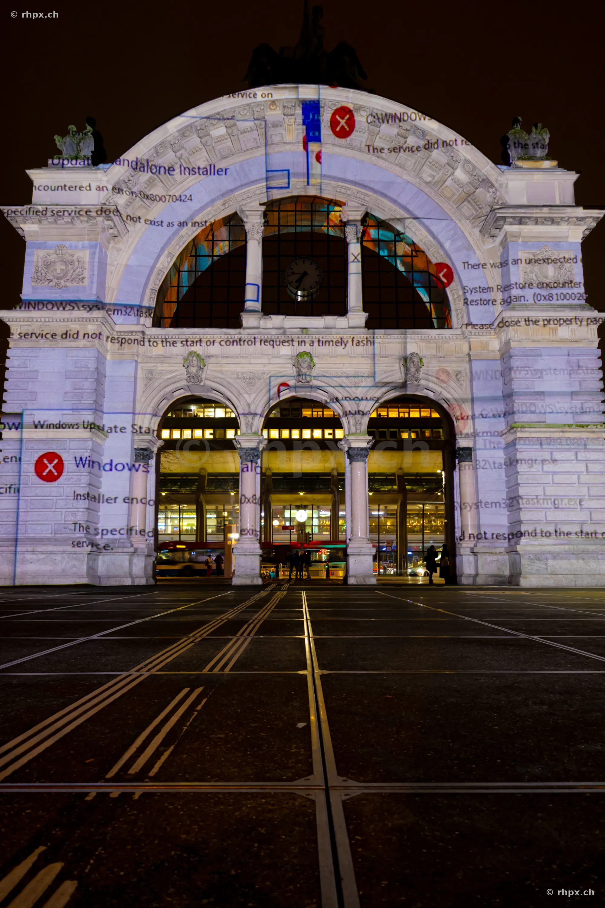 Projection of error messages onto the Lucerne railway station portal during the light festival