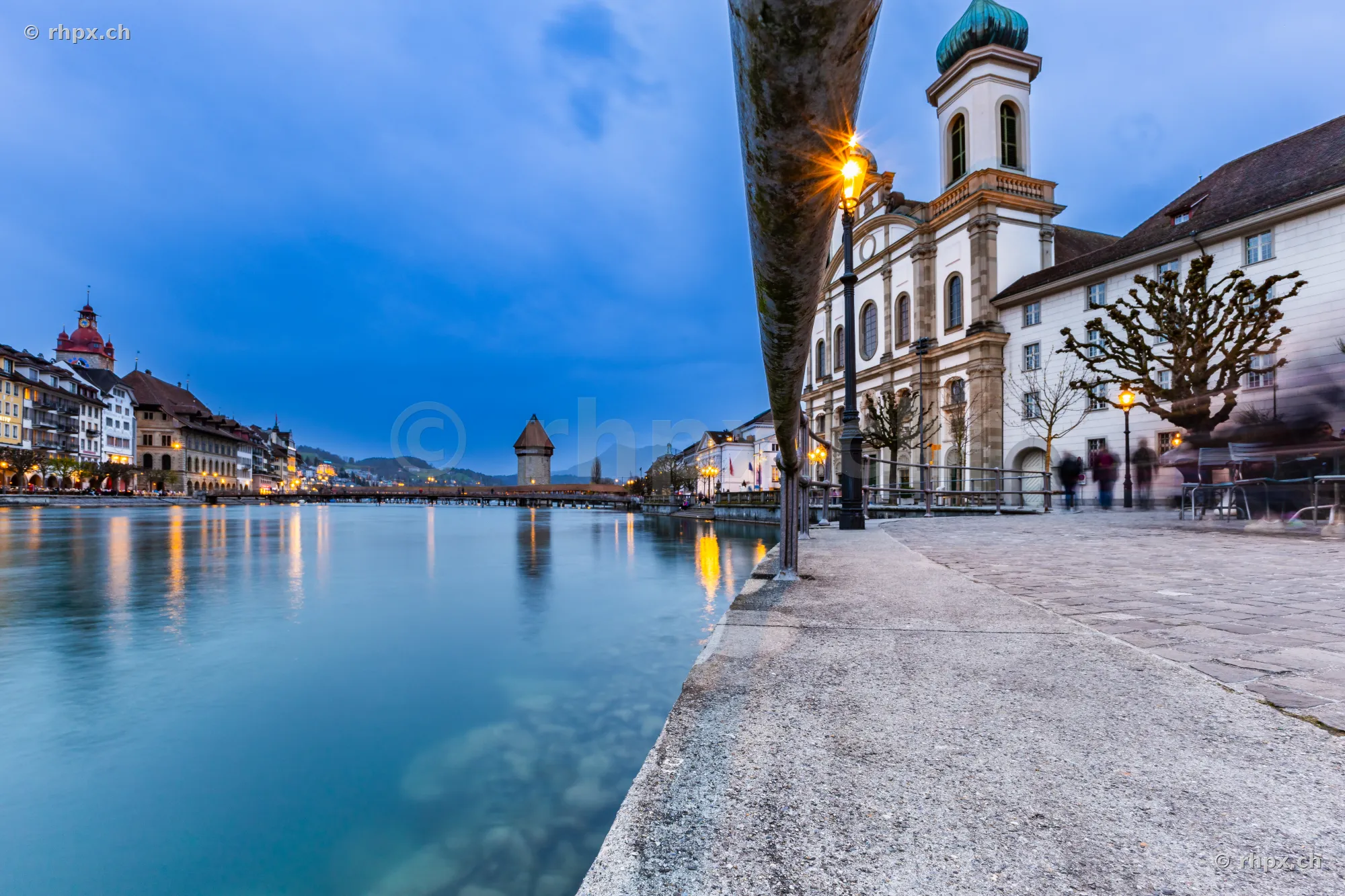 Jesuit Church on the banks of the Reuss river in Lucerne during the blue hour