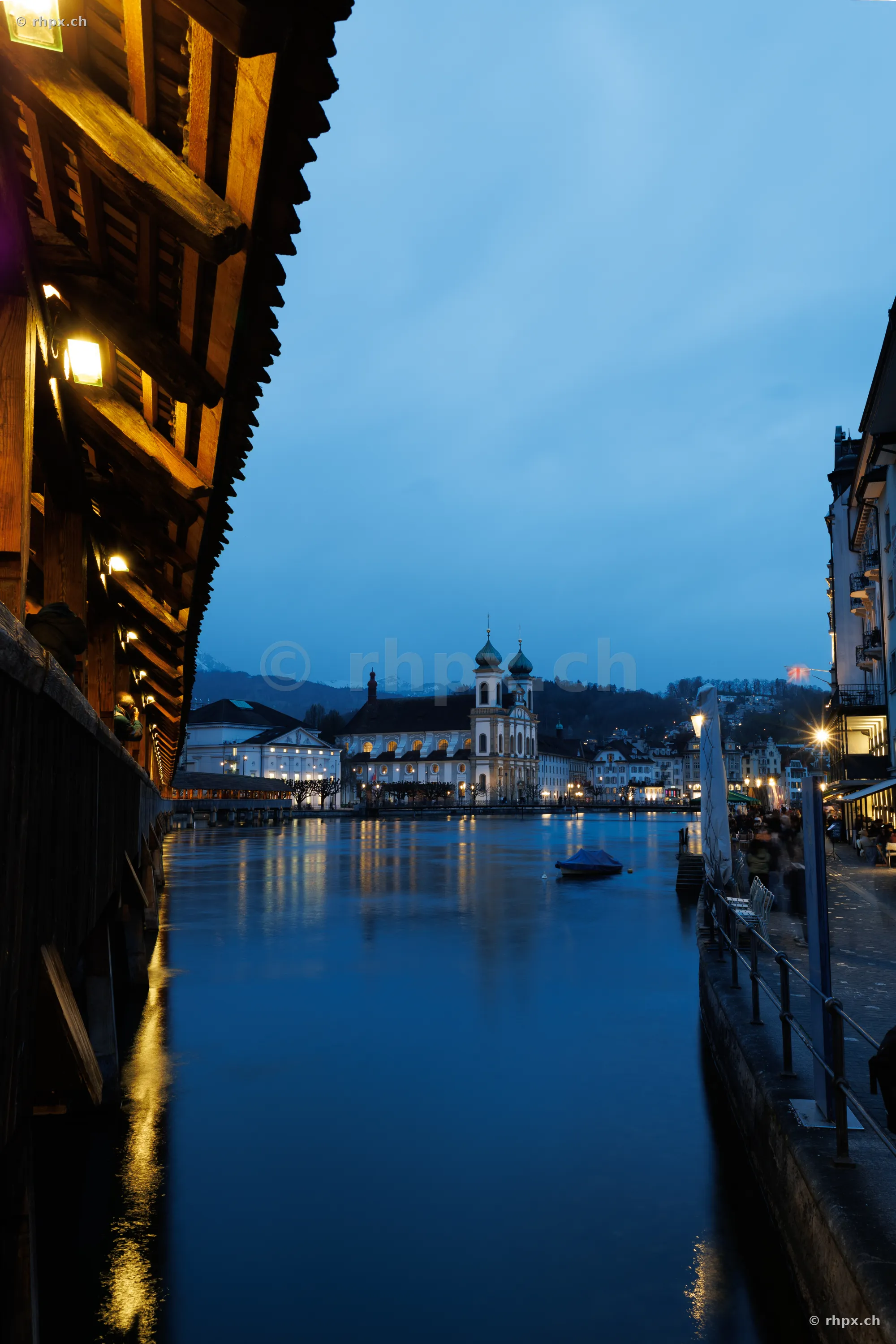 View from Chapel Bridge towards the Jesuit Church in Lucerne at blue hour
