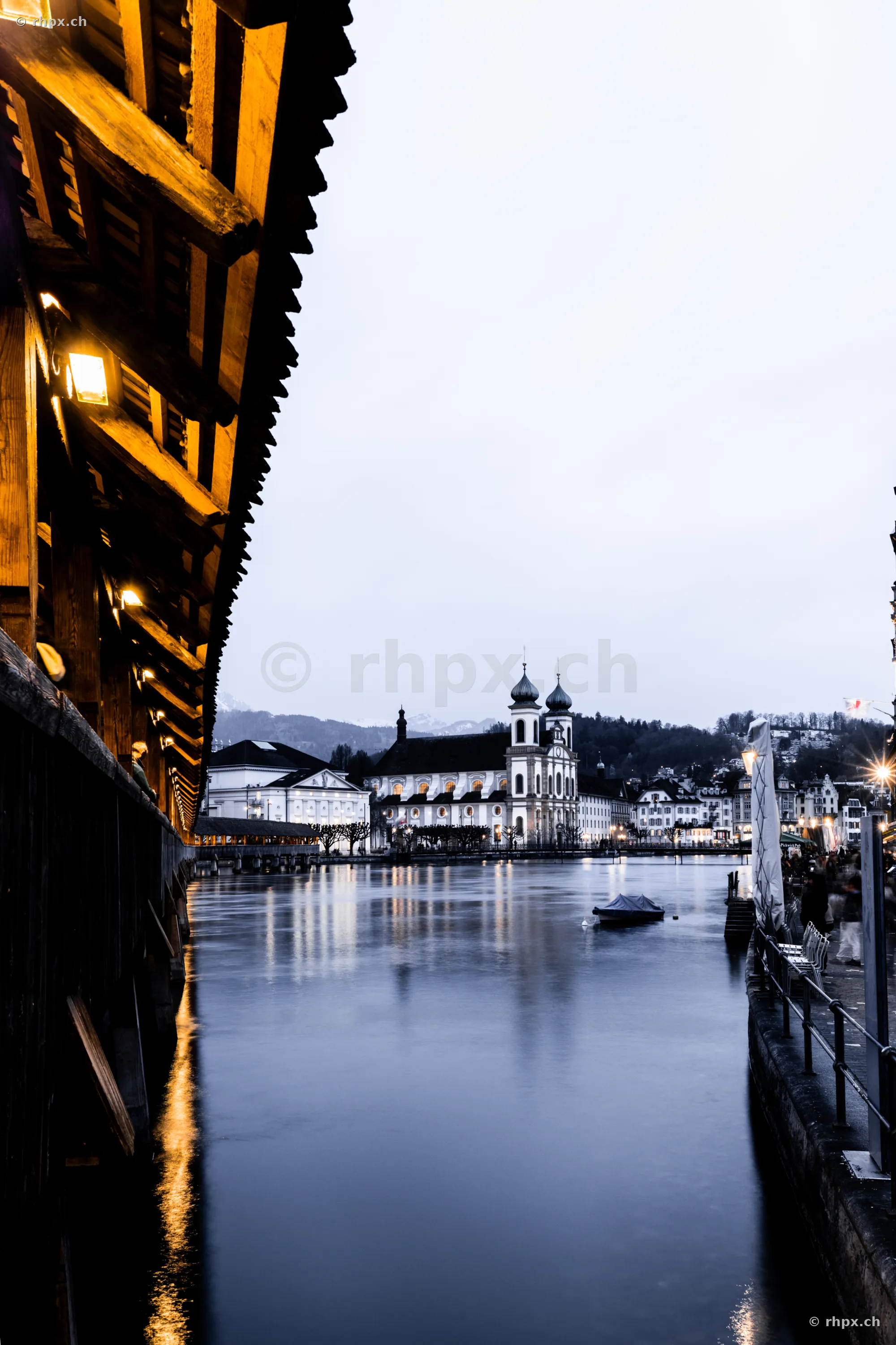 Jesuit Church in Lucerne at dusk, seen from the Chapel Bridge
