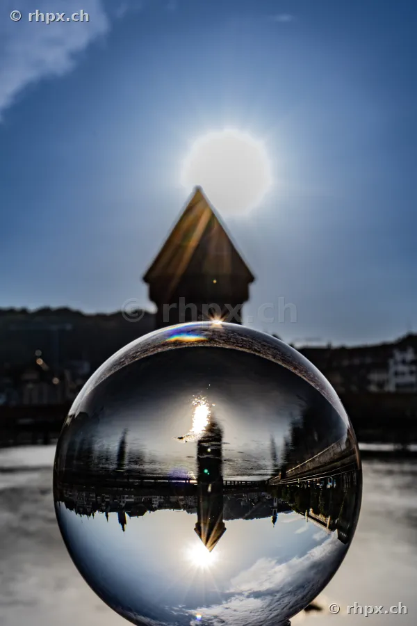 The Chapel Bridge in Lucerne is reflected in a crystal ball.