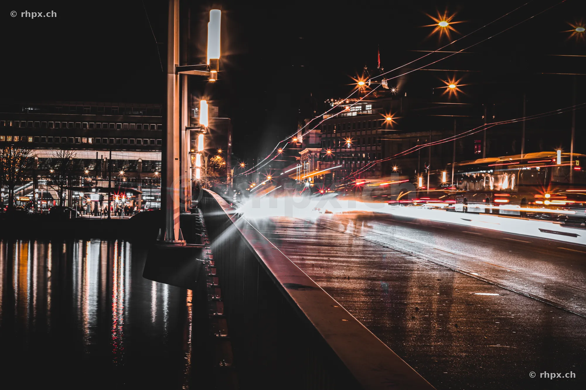 Long exposure of the Seebrücke bridge in Lucerne at night with passing vehicles