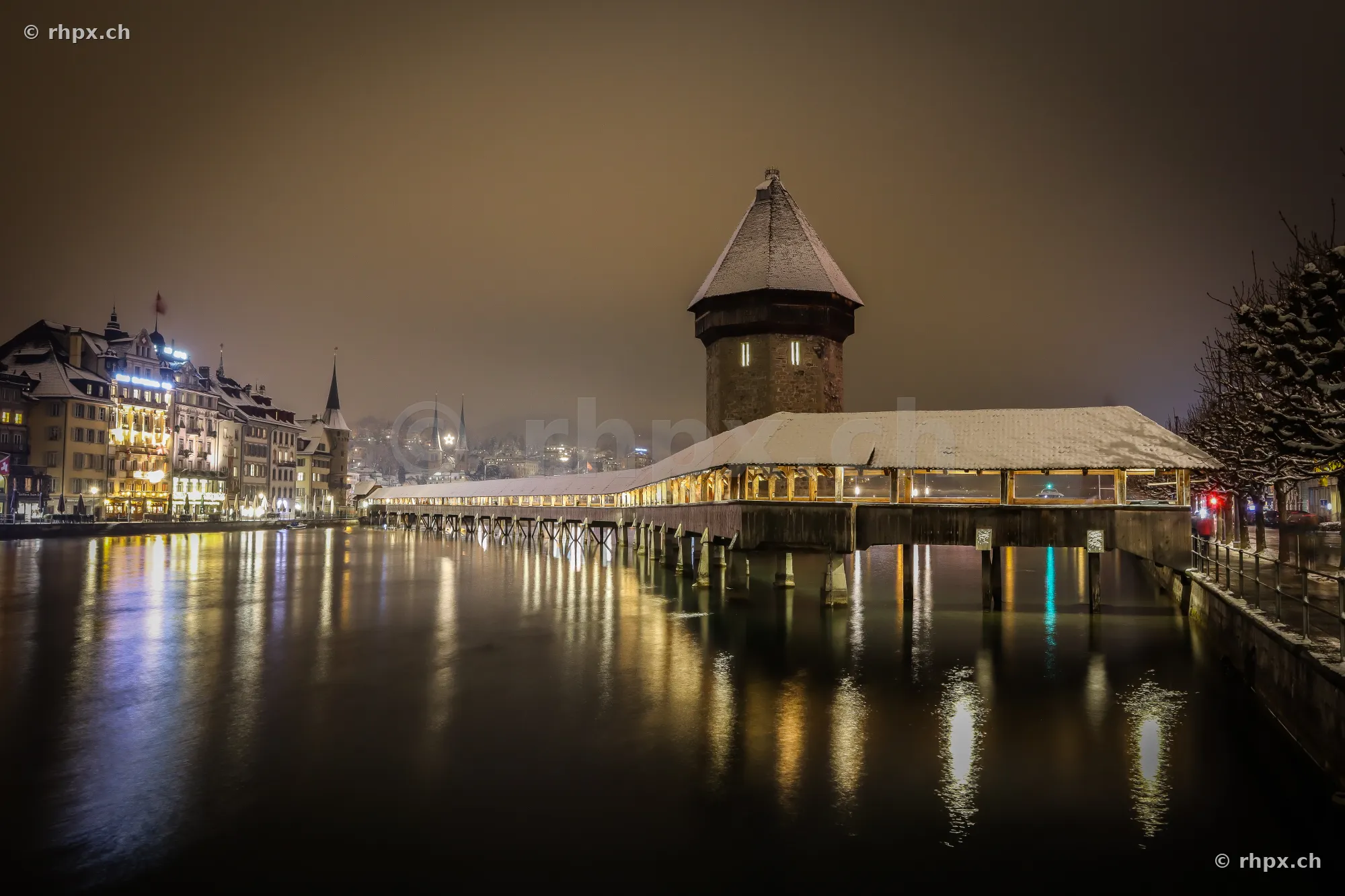 Chapel Bridge and Water Tower in Lucerne on a snowy winter night