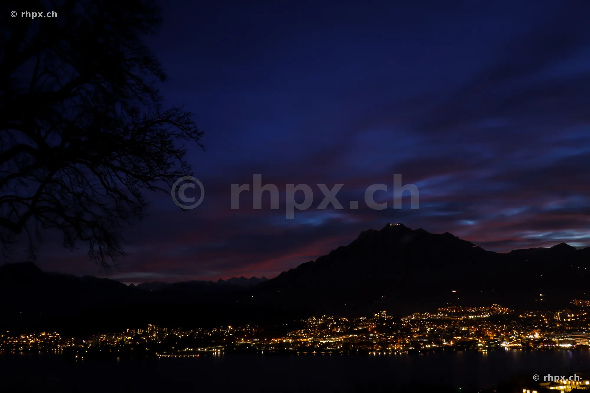 View of nocturnal Lucerne and Mount Pilatus during the blue hour