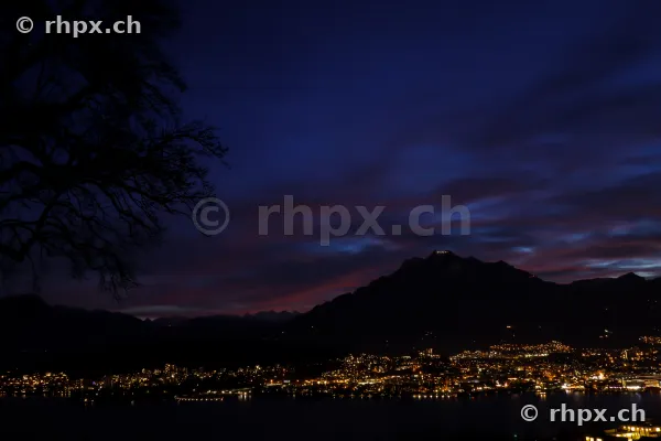 View of nocturnal Lucerne and Mount Pilatus during the blue hour