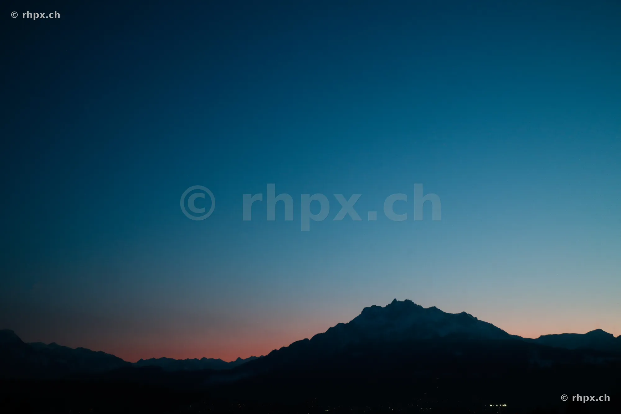 Silhouettes of the Mount Pilatus massif near Lucerne at dusk