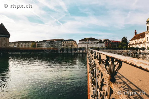 View over the Reuss river with the Rathaussteg bridge and the Chapel Bridge in the background