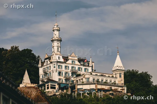The hotel Château Gütsch in Lucerne under a cloudy sky