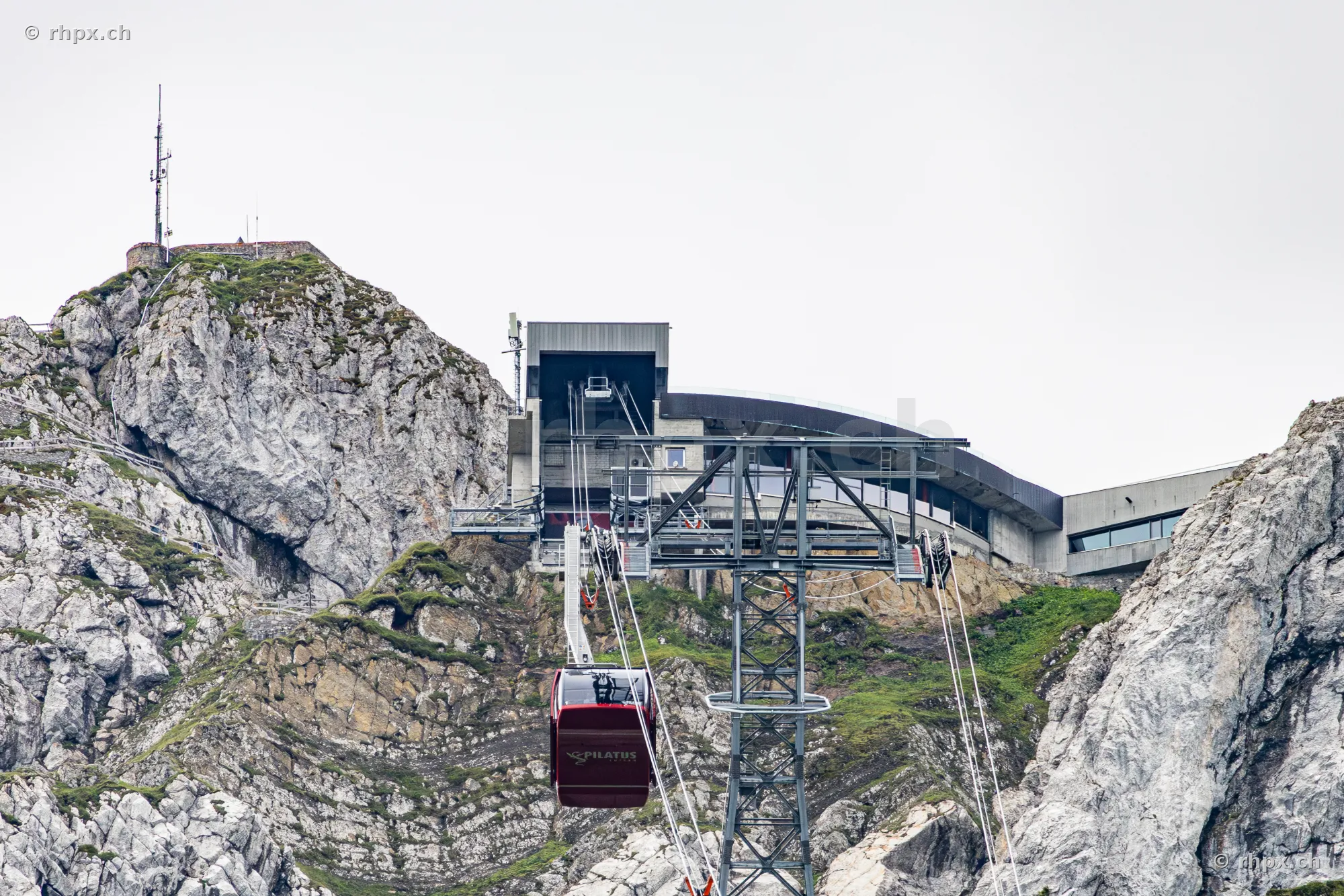 Red cable car near the mountain station on Mount Pilatus near Lucerne