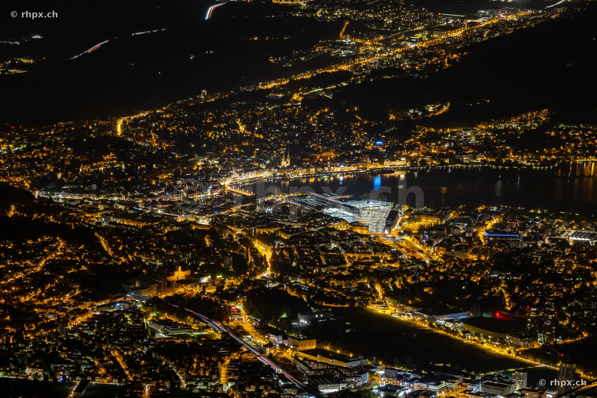Night aerial view of Lucerne with illuminated streets and Lake Lucerne
