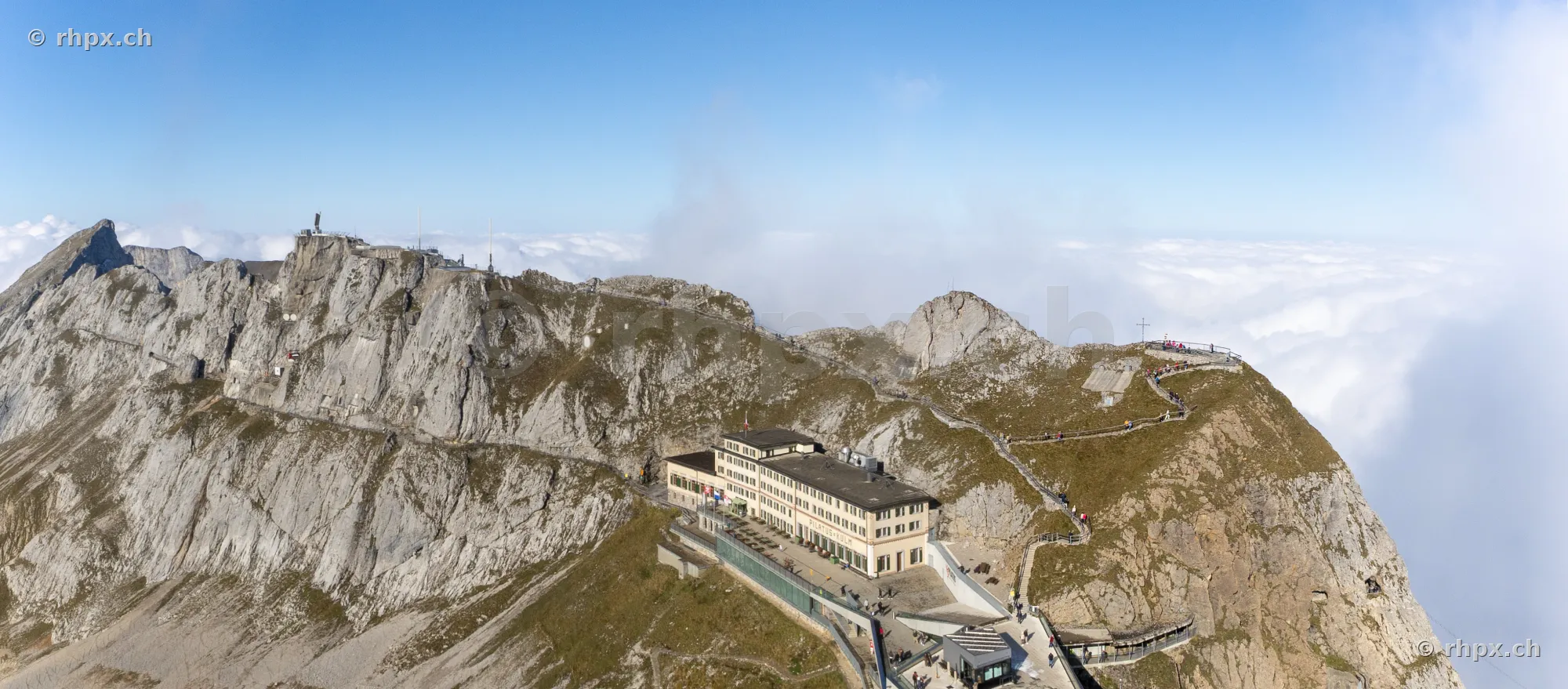 Aerial view of the Pilatus summit with Hotel Bellevue and surrounding cloud cover