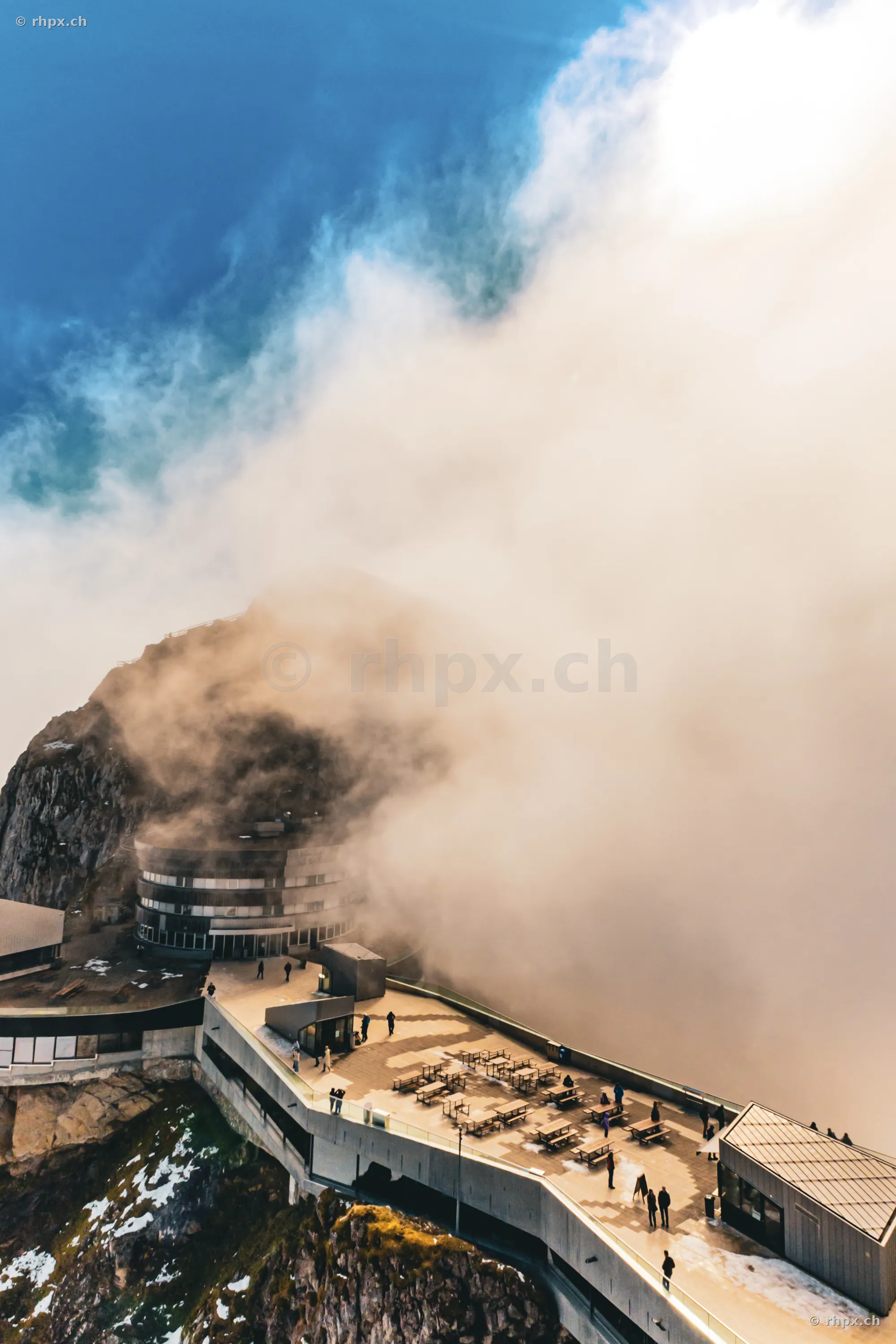 The terrace of the Hotel Pilatus-Kulm surrounded by dense clouds