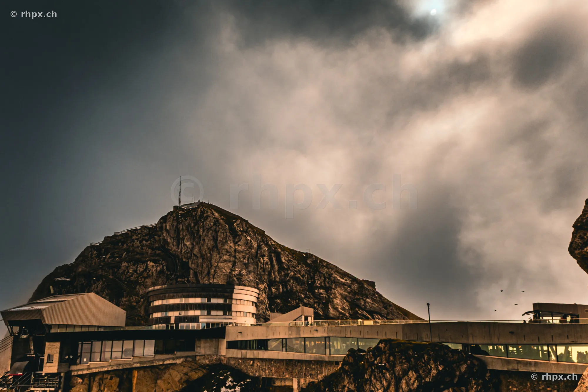 Hotel Bellevue and mountain station on Mount Pilatus under a cloudy sky