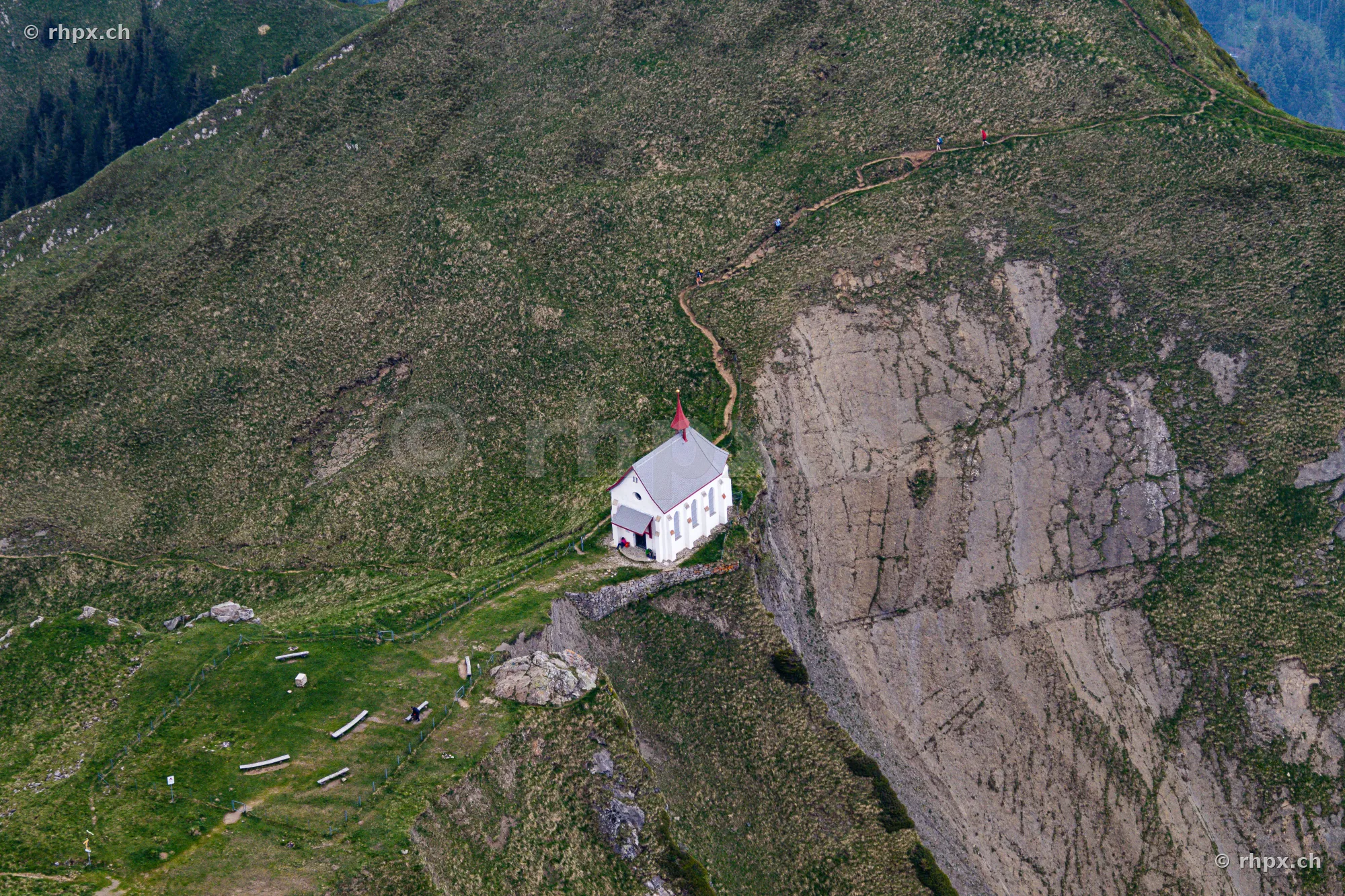 Aerial view of the Pilatus chapel embedded in the mountain range near Kriens and Lucerne