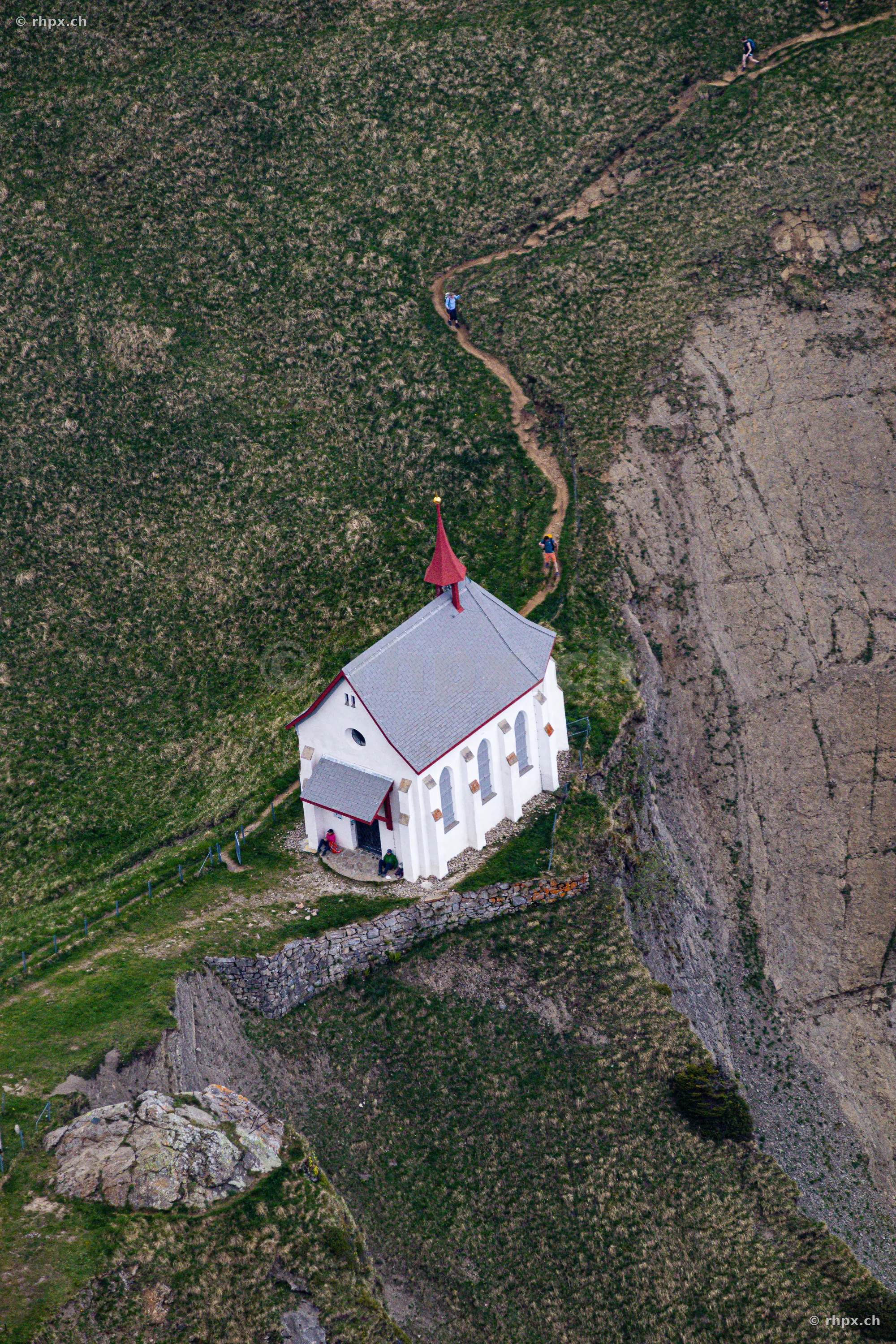 Aerial view of the Pilatus chapel with hiking trail in Central Switzerland