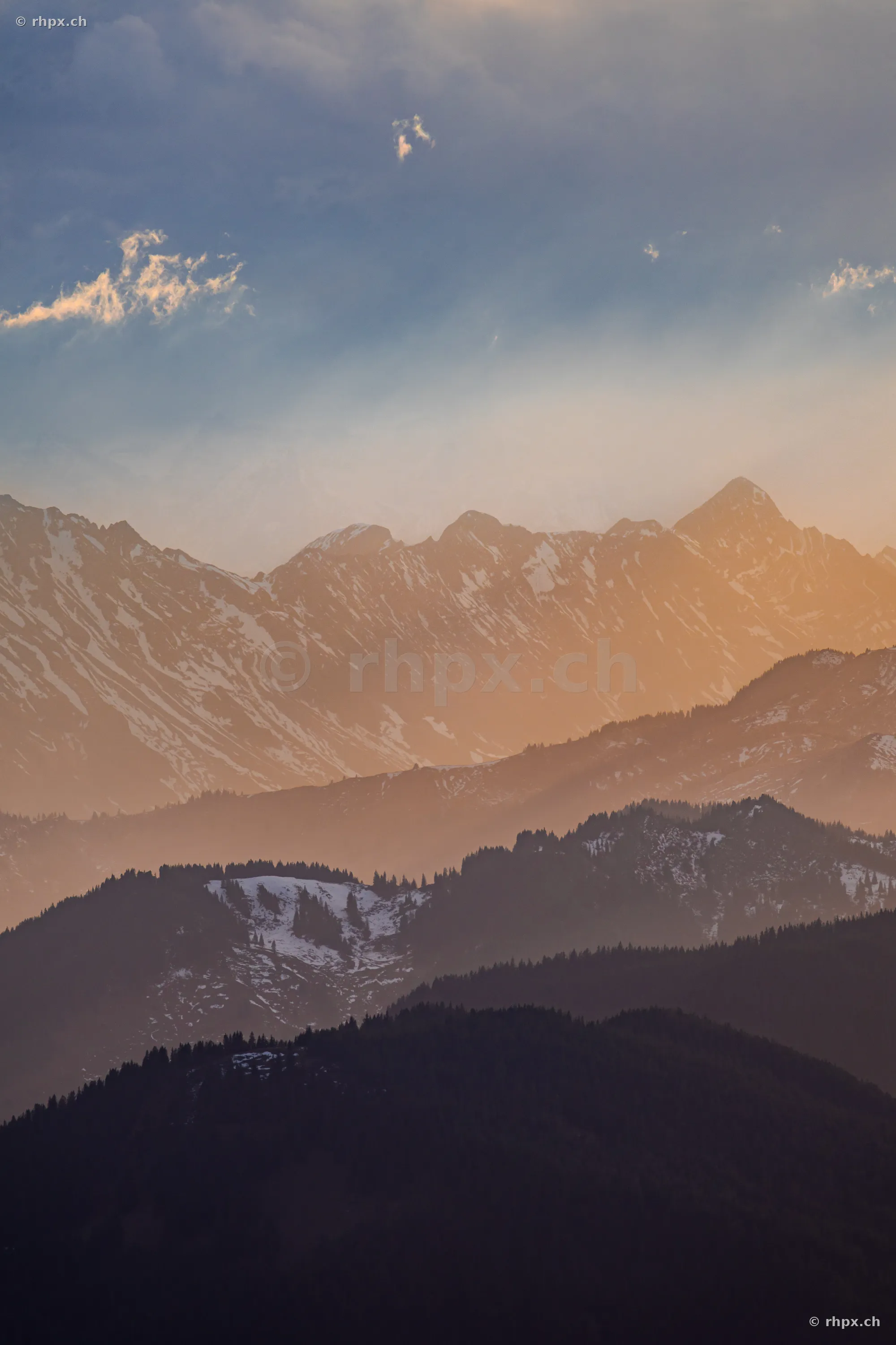 Layered mountain ridges of the Pilatus region in Central Switzerland during sunset