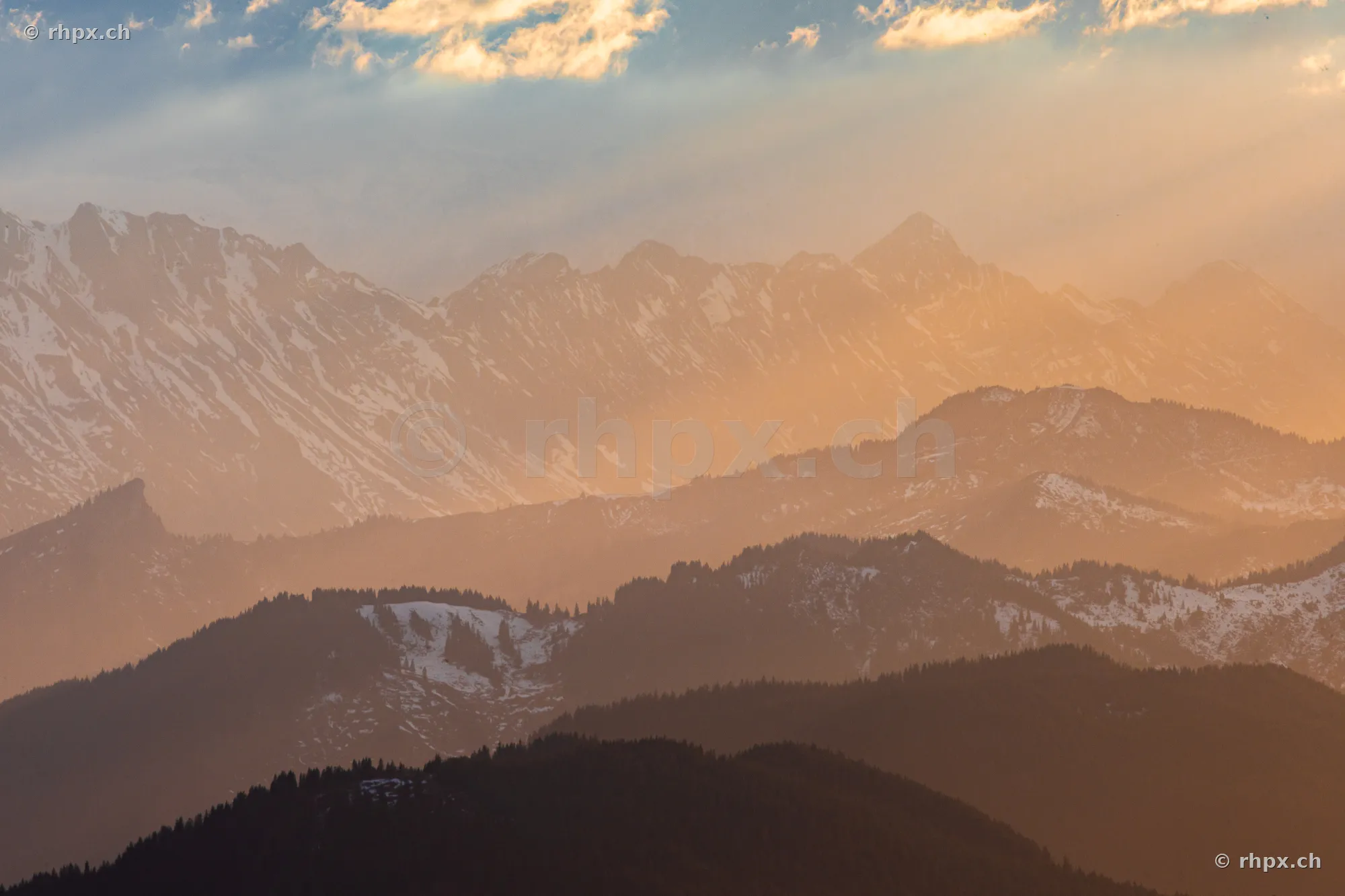 View of the staggered peaks of Mount Pilatus in golden light