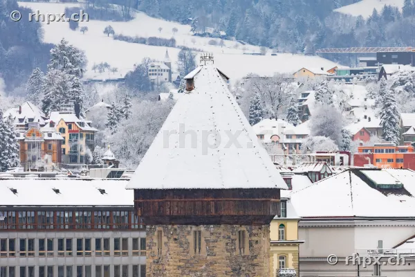 Snow-covered Water Tower in Lucerne in front of a wintry backdrop