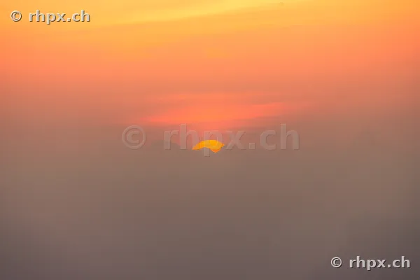 Silhouette of the Pilatus massif in Central Switzerland during an orange sunset