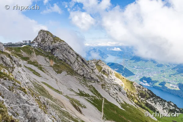 View of the Pilatus summit with hotel and a panorama of the Central Swiss lake landscape