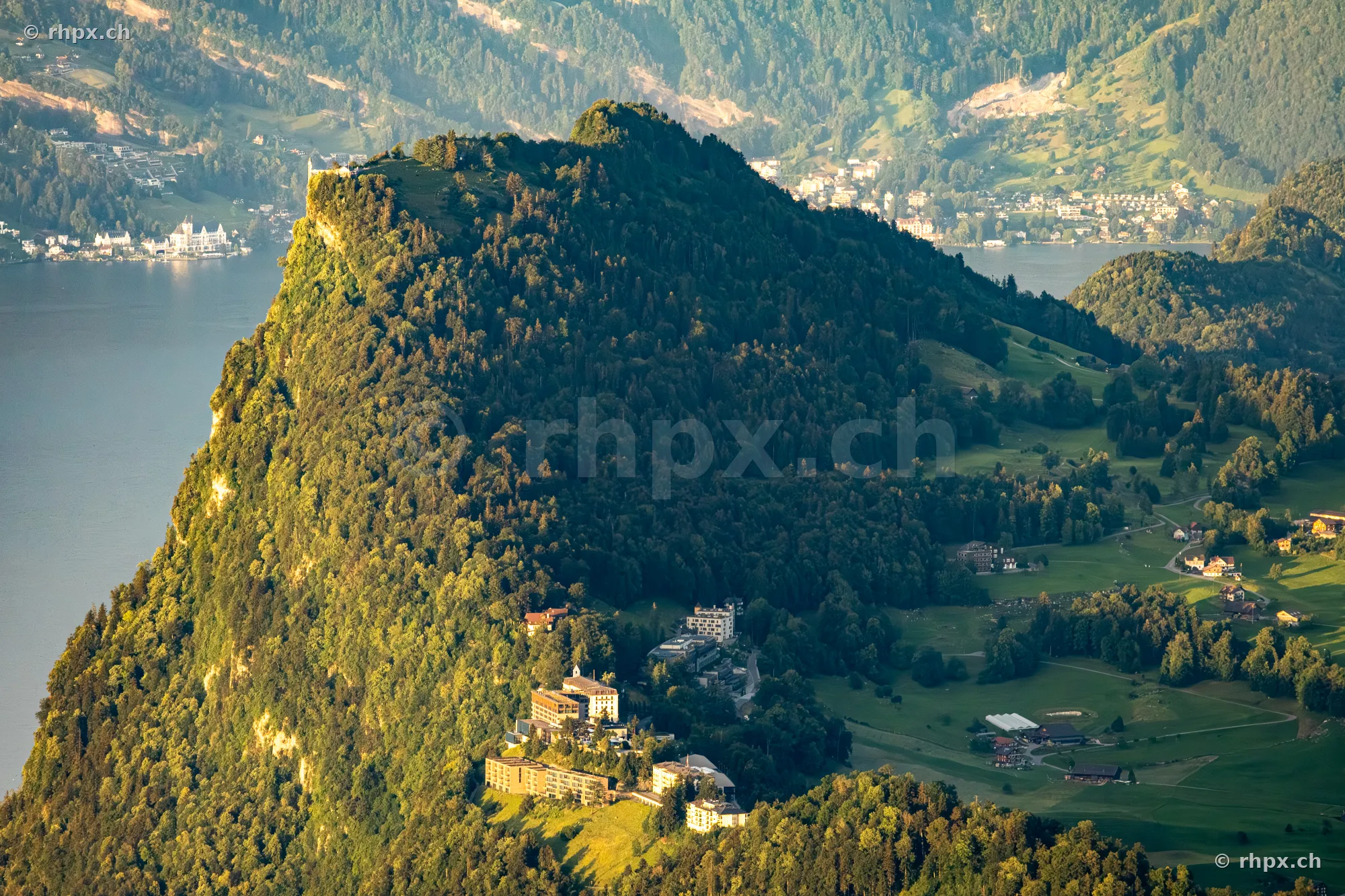 Aerial view of the forested Bürgenstock mountain above Lake Lucerne at sunset