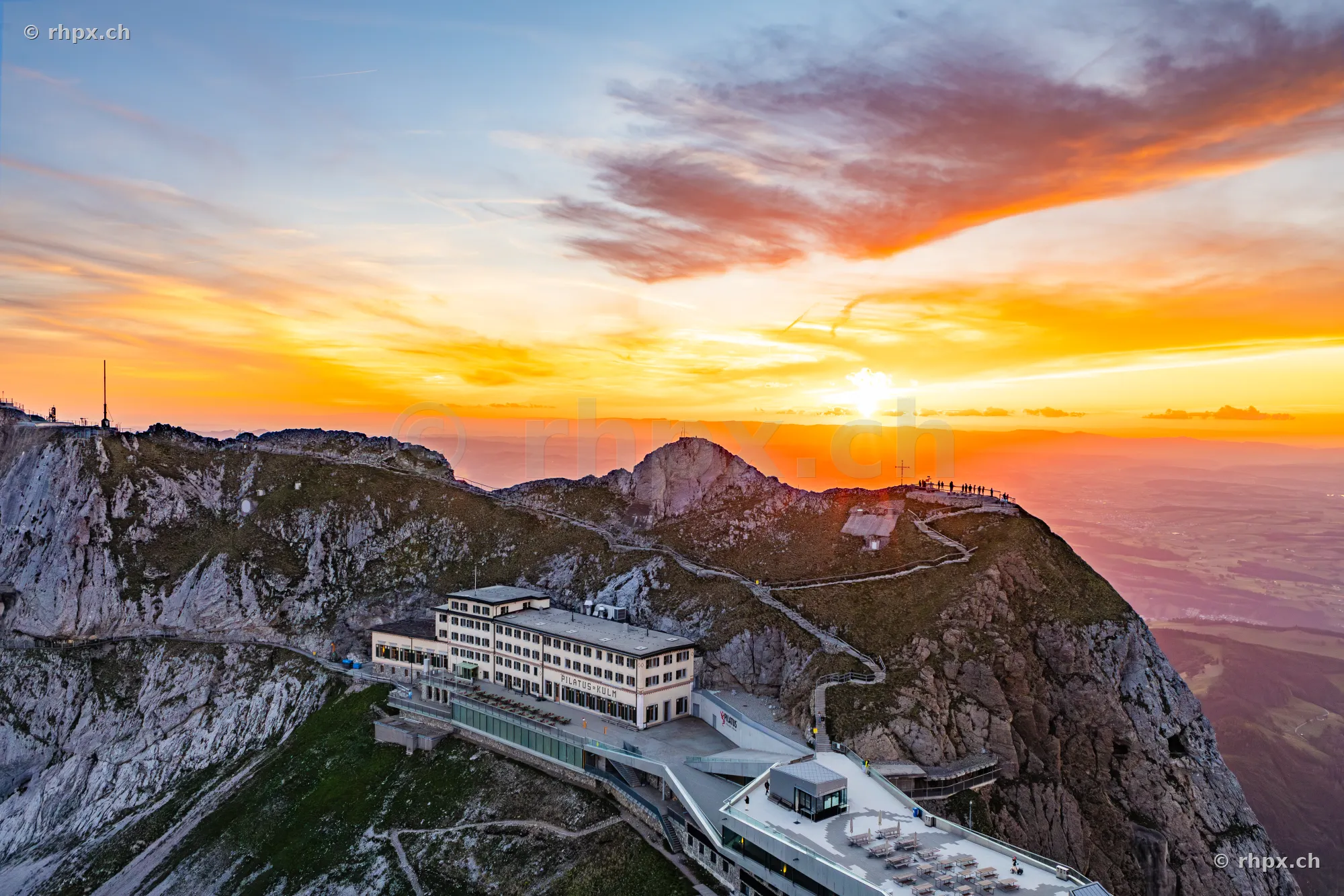 View of Hotel Pilatus-Kulm and the summit area at golden sunset
