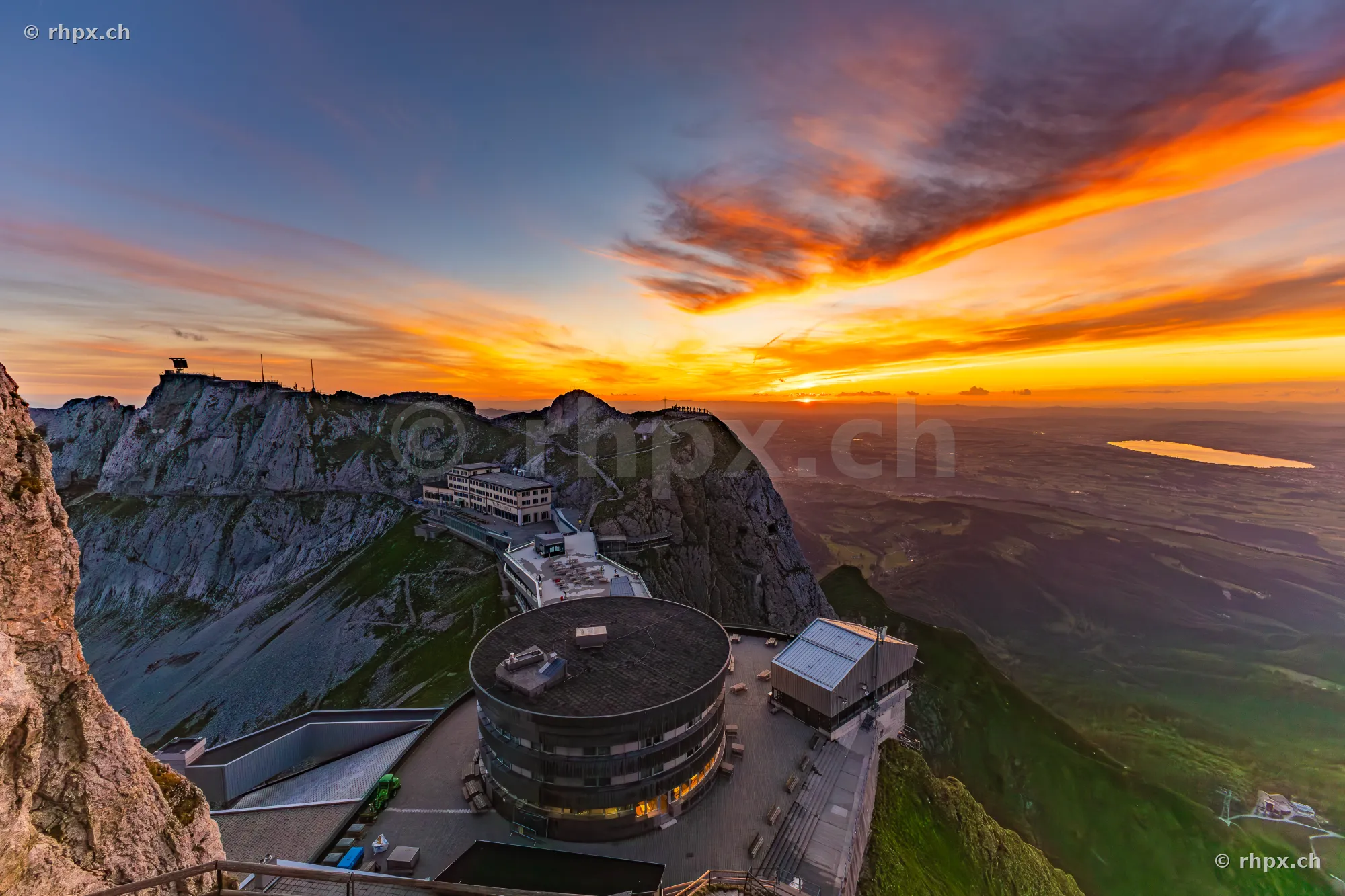 Aerial view of the summit buildings on Mount Pilatus during golden sunset