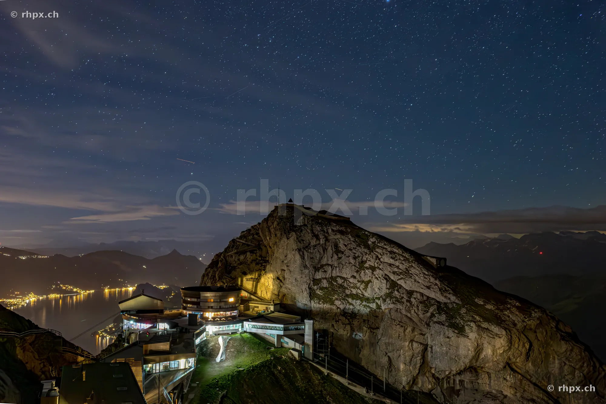 View of Mount Pilatus summit with hotel and starry sky