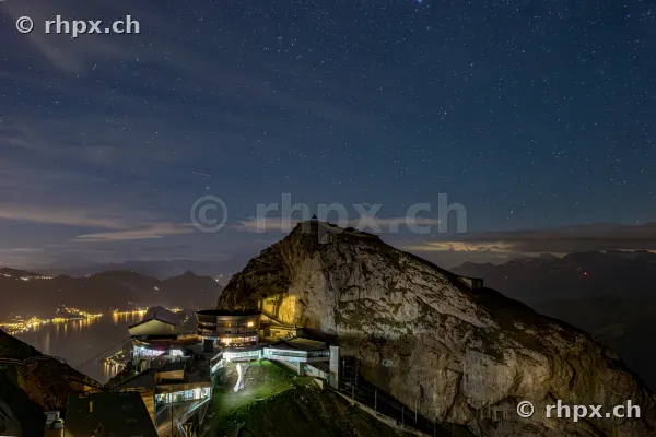 View of Mount Pilatus summit with hotel and starry sky