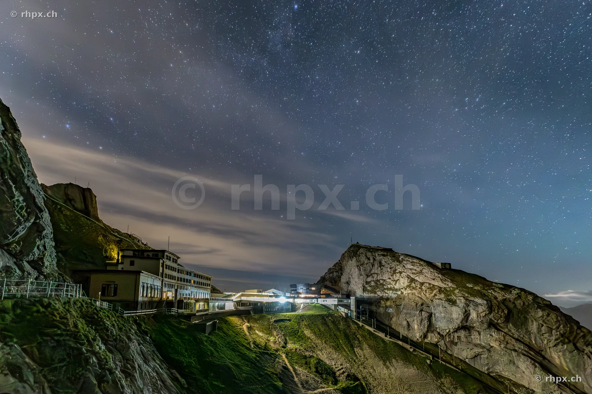The illuminated Hotel Pilatus-Kulm set against a starry night sky in Central Switzerland.