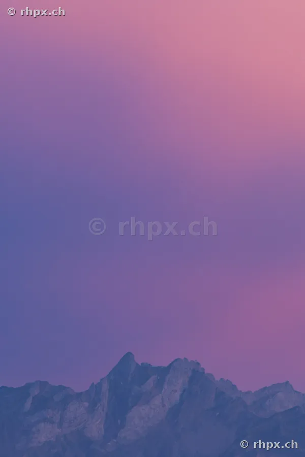 Silhouette of the Pilatus massif against a violet evening sky