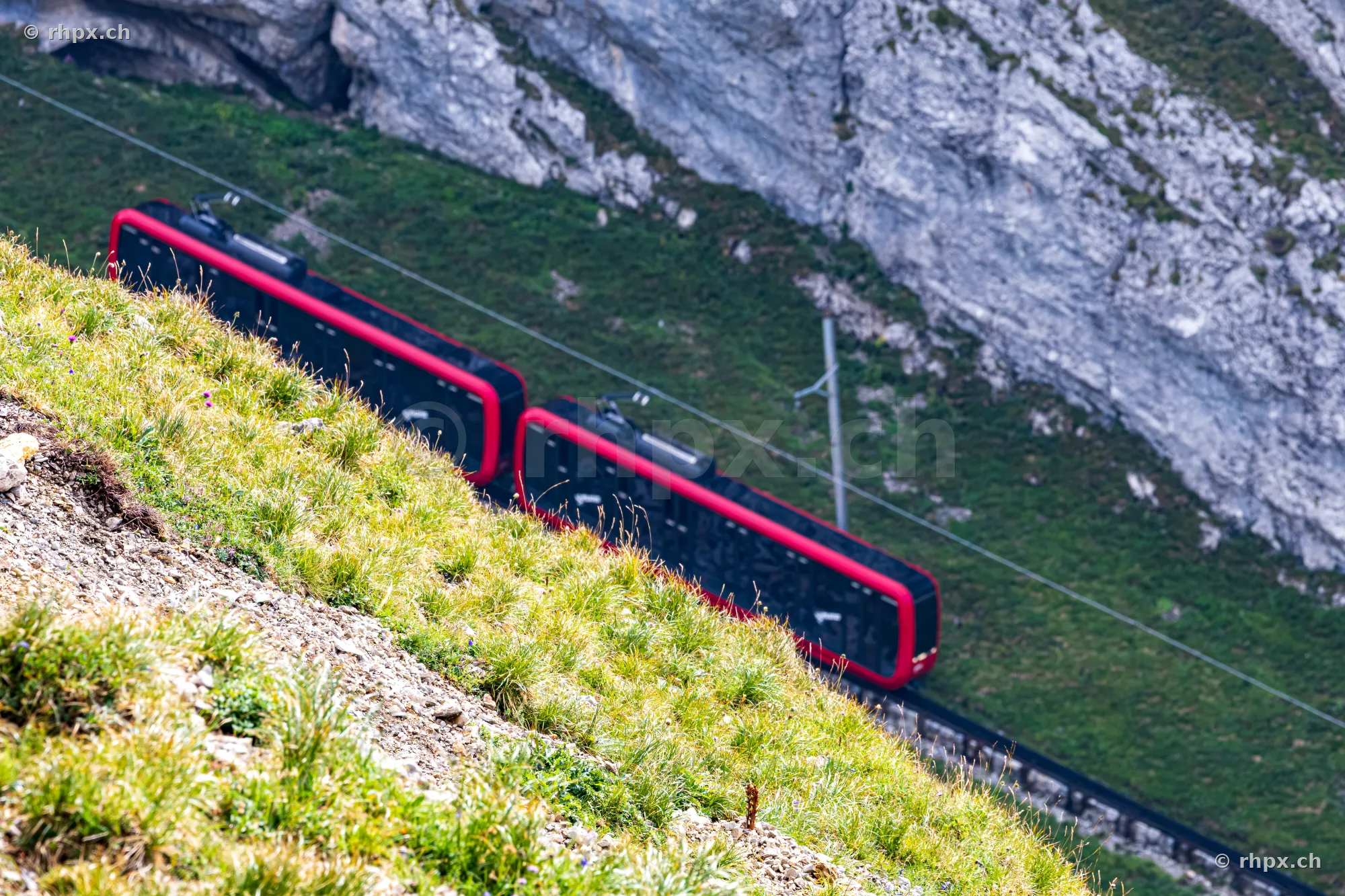 The Pilatus cogwheel railway runs along a steep cliff.