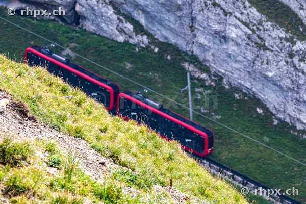 The Pilatus cogwheel railway runs along a steep cliff.