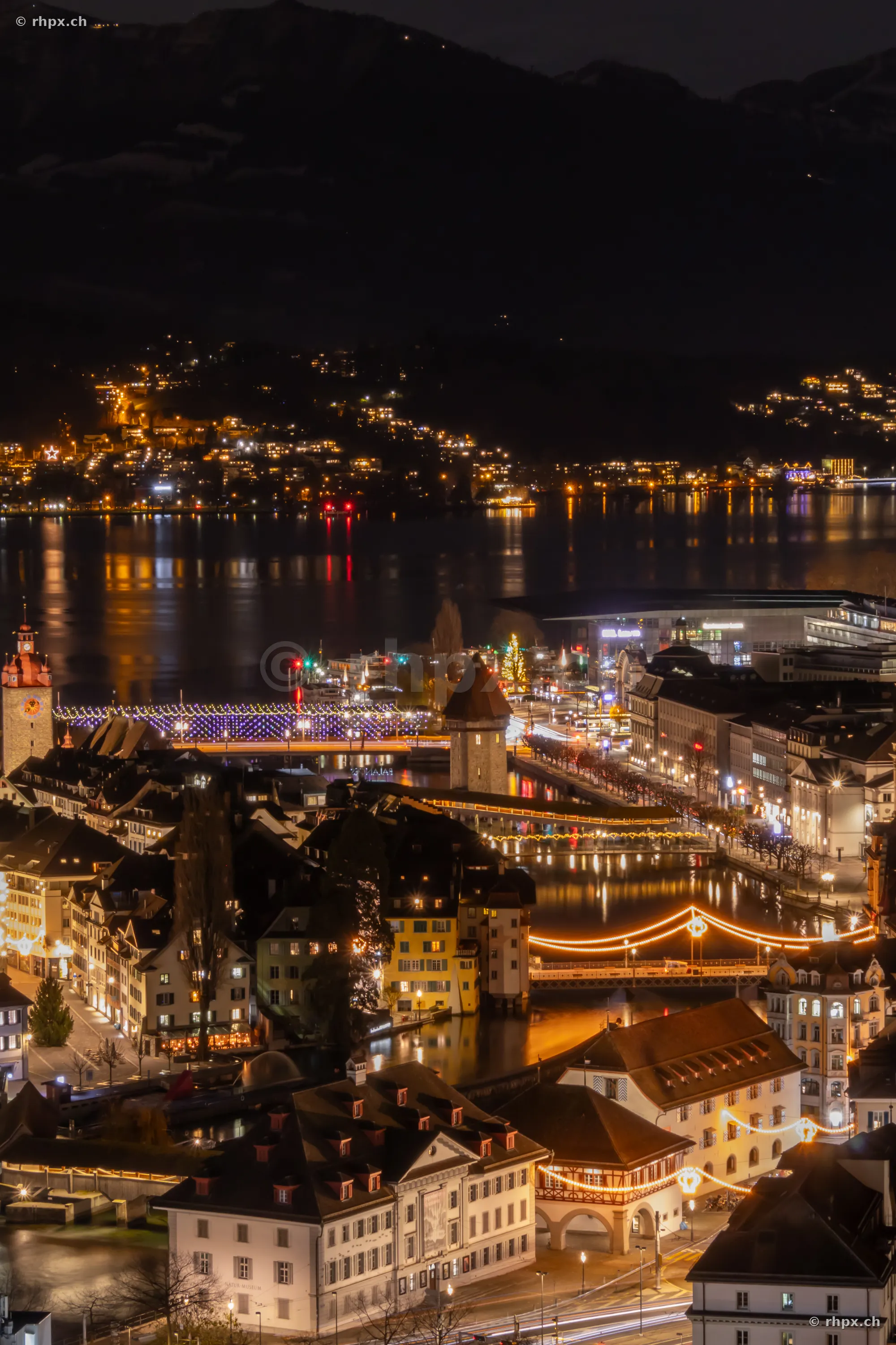 Aerial view of the illuminated old town of Lucerne at night during the Christmas season