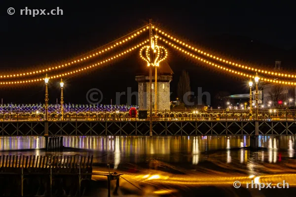Christmas fairy lights on the Chapel Bridge in Lucerne at night