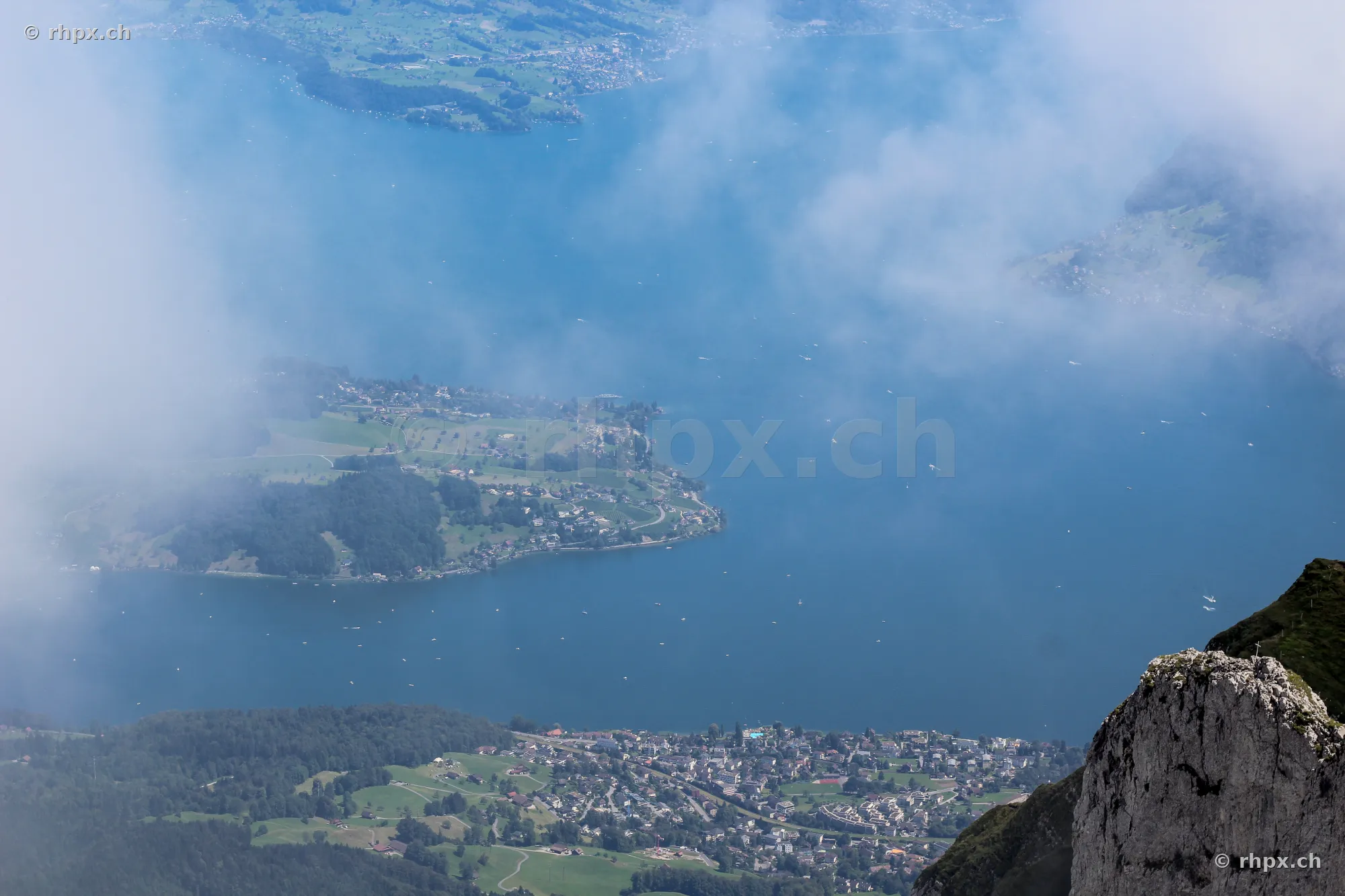 Aerial view from Mount Pilatus onto Lake Lucerne with fog patches
