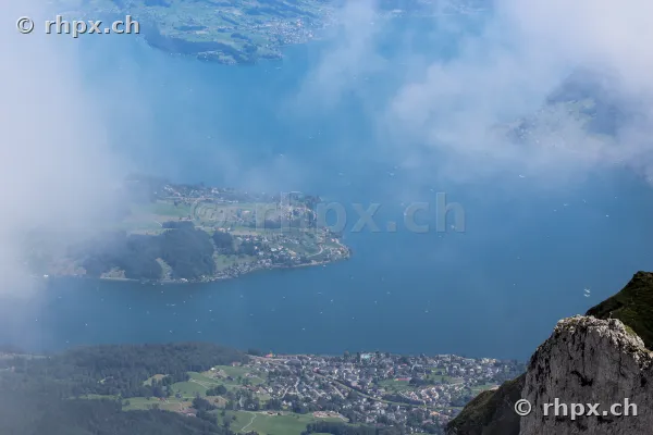 Aerial view from Mount Pilatus onto Lake Lucerne with fog patches