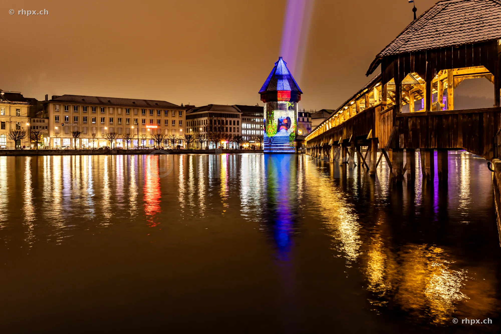 Chapel Bridge and Water Tower in Lucerne during the Lilu Light Festival at night
