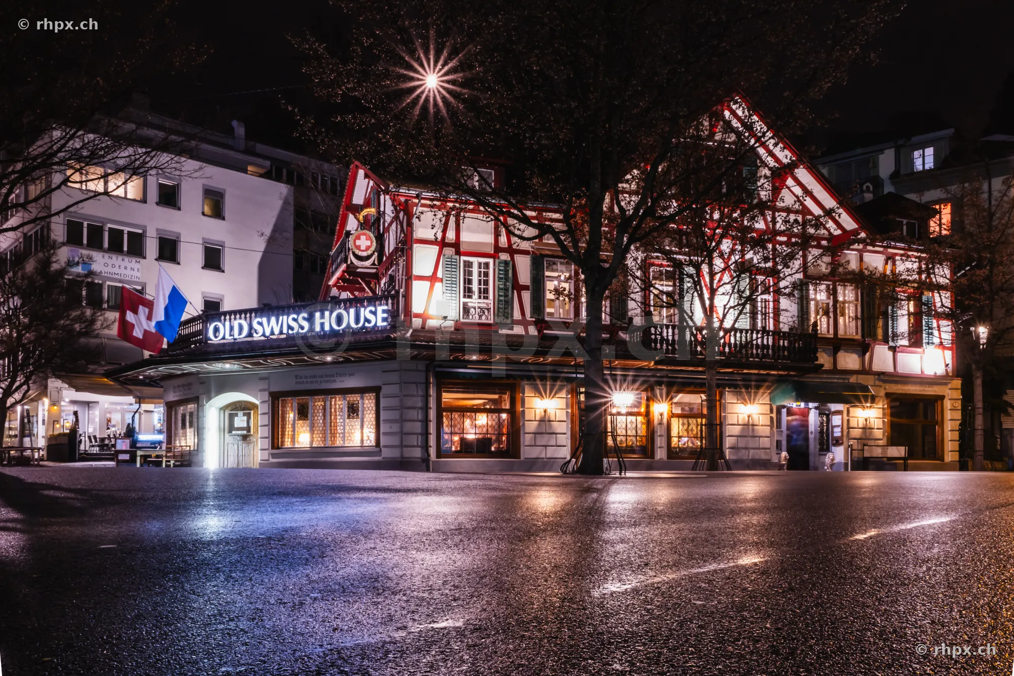 The illuminated Old Swiss House restaurant in Lucerne at night