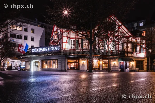 The illuminated Old Swiss House restaurant in Lucerne at night
