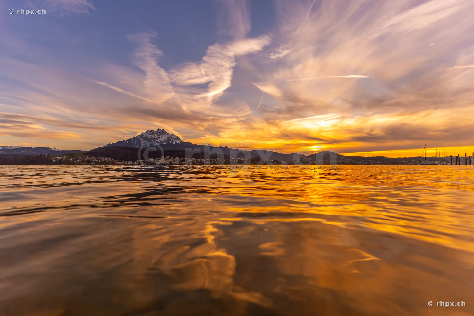 View across Lake Lucerne with Mount Pilatus in the background at sunset