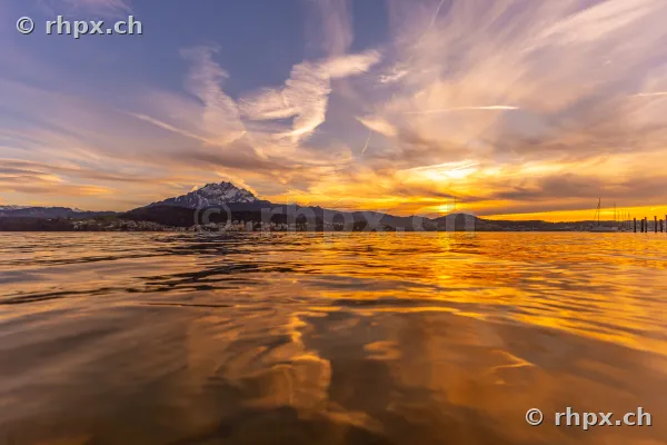 View across Lake Lucerne with Mount Pilatus in the background at sunset
