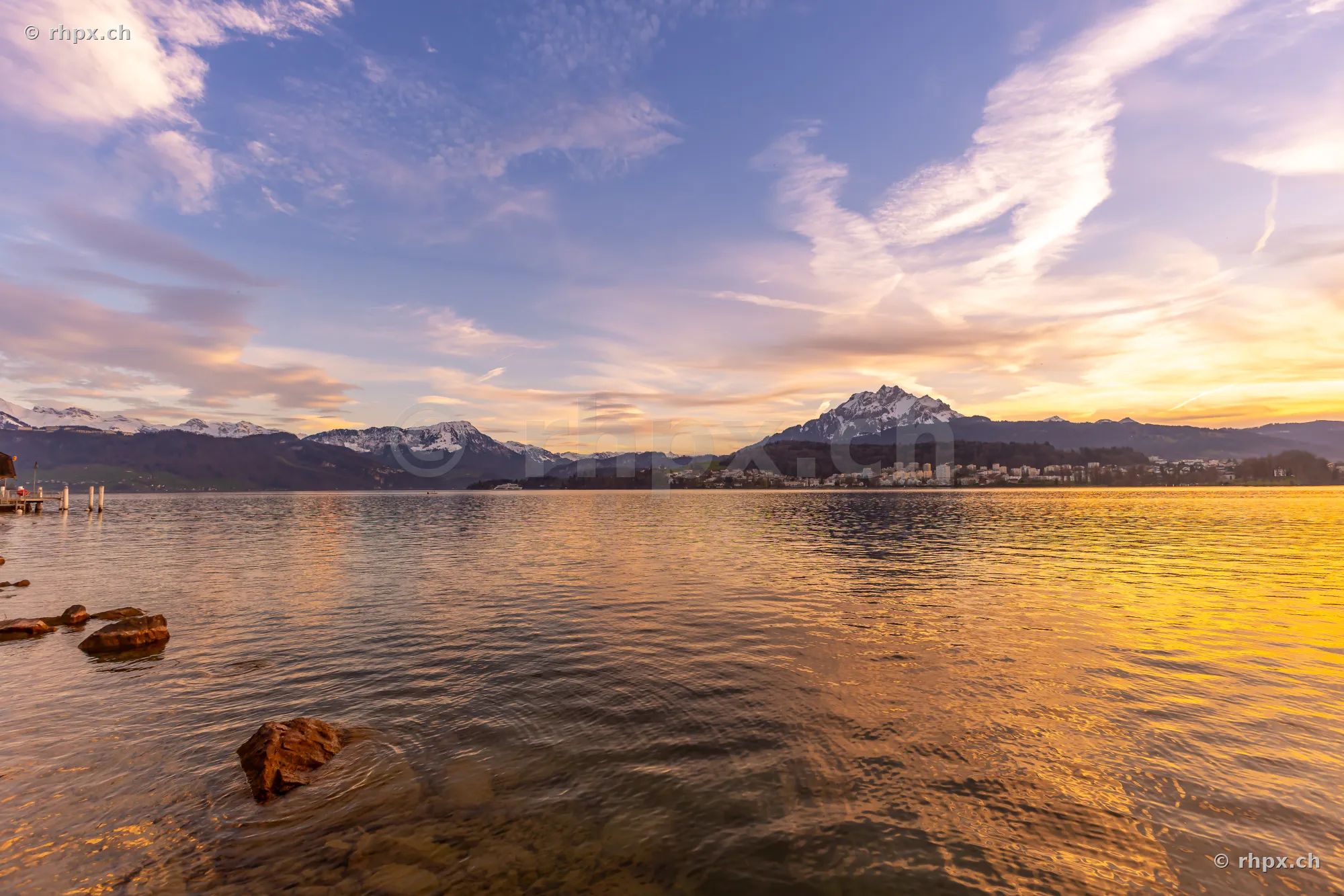 View across Lake Lucerne towards Mount Pilatus at sunset