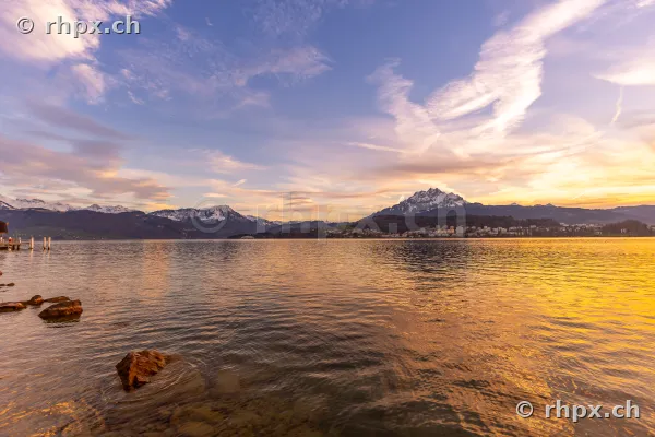 View across Lake Lucerne towards Mount Pilatus at sunset