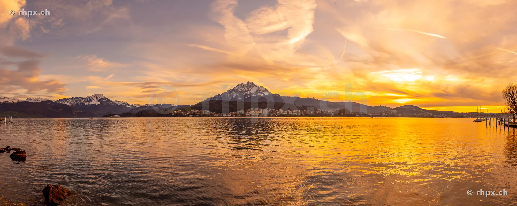 View across Lake Lucerne towards Mount Pilatus at sunset
