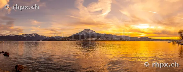 View across Lake Lucerne towards Mount Pilatus at sunset
