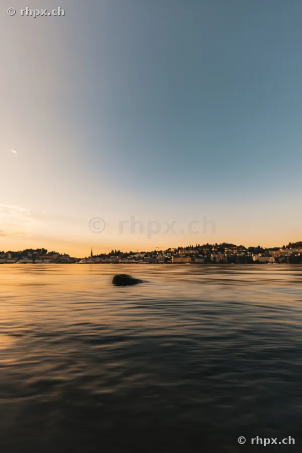 View of Lake Lucerne and the city of Lucerne in the golden light of dusk